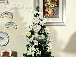 Christmas tree decorated with white flowers
