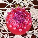 pink christmas ball decorated with pearls