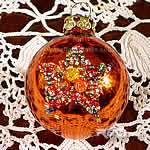 christmas ball decorated with beads by hand