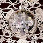 silver christmas ball decorated with sequins