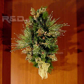 Hand-decorated pine branch for your Christmas door with golden ornaments