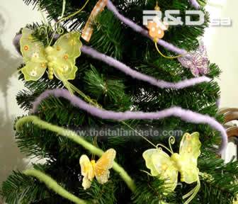 Easter tree decorated with yellow and orange butterflies and felt cords with spring colors