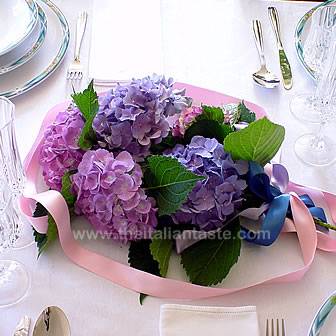 a centerpiece made with blue hydrangeas