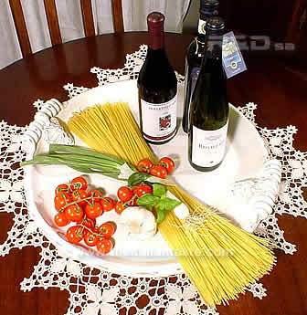 Italian style centerpiece made with spaghetti and wine bottles