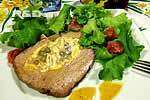 stuffed beef pocket accompanied by green salad