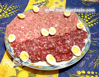 italian antipasto with salami and quail eggs