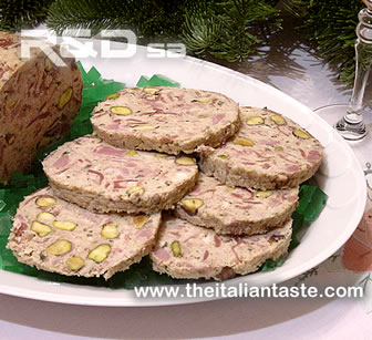 chicken galantine surroundd by green cube of aspic