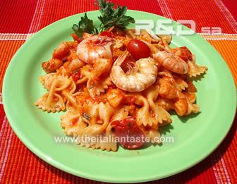 Pasta dressed with tomato and prawn sauce