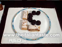 mixed pastries arranged in a serving dish according the initials of lovers, a typical dish for Valentines menu