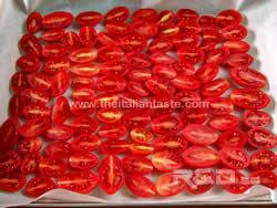 confit tomatoes: red grape tomatoes halved and arranged in a baking pan
