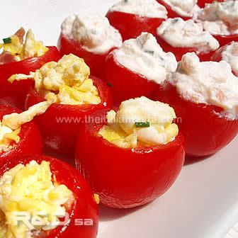 Cherry tomatoes filled with scrambled eggs and ricotta with salmon