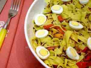 fettucine with caviar sauce and quail eggs; they are also flavored with grilled bell peppers