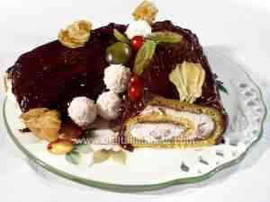 buche de Noel covered with chocolate cream and filled with chestnut cream, whipping cream and marron glacés