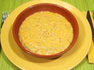 Milk-rice-pumpkin soup in a crock bowl