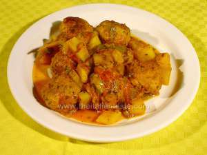 italian meatballs with peppers and potatoes in tomato sauce