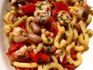 Italian pasta salad with octopus, beans, ripe tomatoes