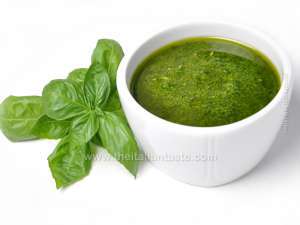 Pesto sauce for tossing Italian pasta; it is made with pine nuts, olive oil, basil, pecorino and Parmigiano cheese, garlic