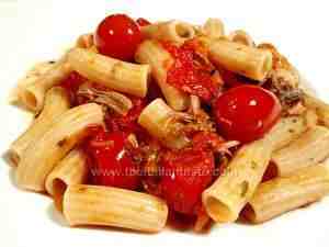 macaroni tossed with duck and tomato sauce, a tasty dish for an italian dinner party
