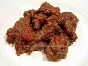 Beef stew, the photo shows the beef pices on the plate in their tomato sauce
