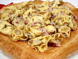 Tortellini tossed with cream-and-ham sauce served on puff pastry