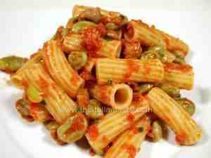 Rigatoni dressed with tomato sauce, fava beans and sausage