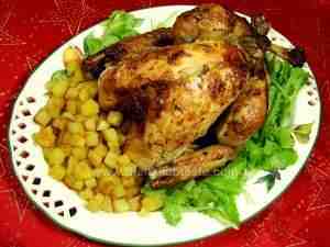 Roasted whole turkey served in platter accompanied by potatoes and green salad