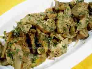 Artichokes cooked in olive oil with garlic and parsley, Italian recipe ideal for gevegetarian or vegan diet
