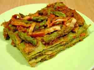 Italian green lasagna dressed with salmon and asparagus sauce
