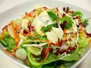 Autumnal assorted salad with chicory, cabbage, apples, cucumber, lettuce, onion and mayonnaise