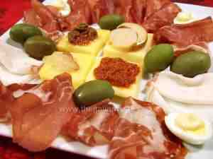 Italian assorted starter with cold cuts and canapes