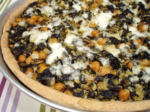 Savory tart with salt cod, chickpeas and kale